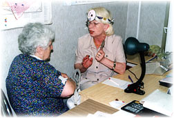 Volunteer - specialist in ear, nose and throat diseases is consulting the clients